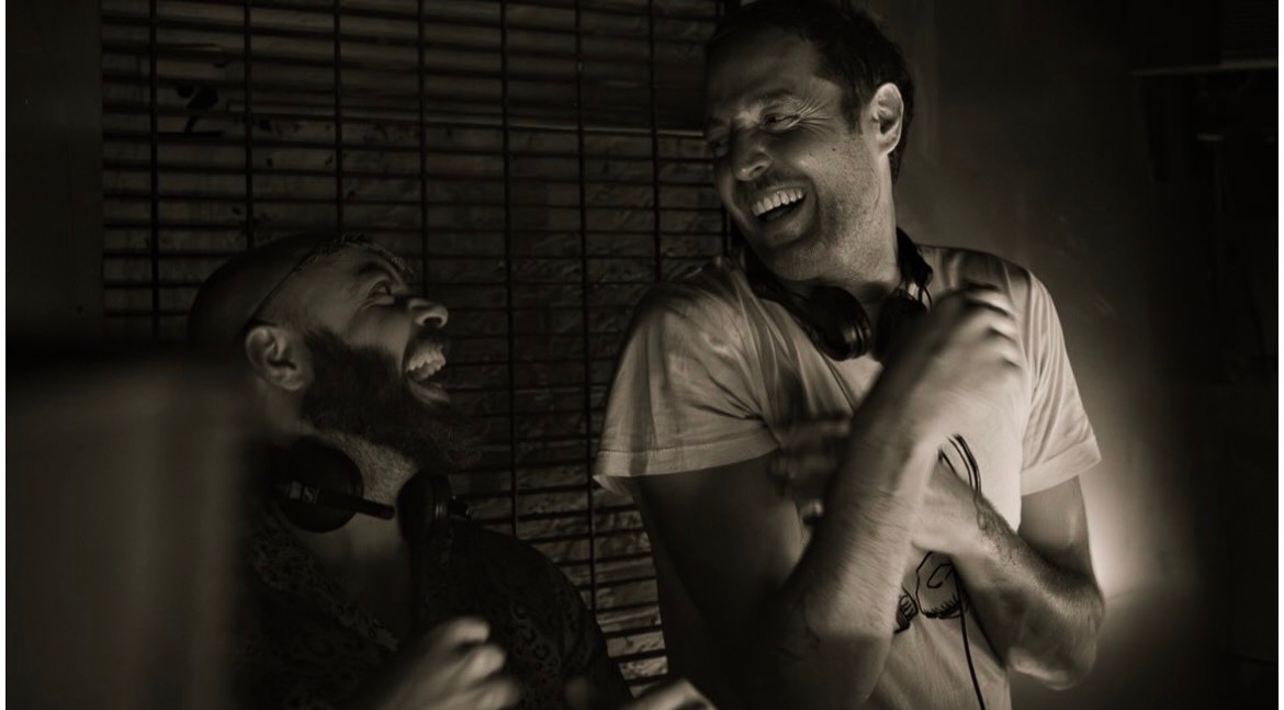 Guru Davar laughing with another DJ