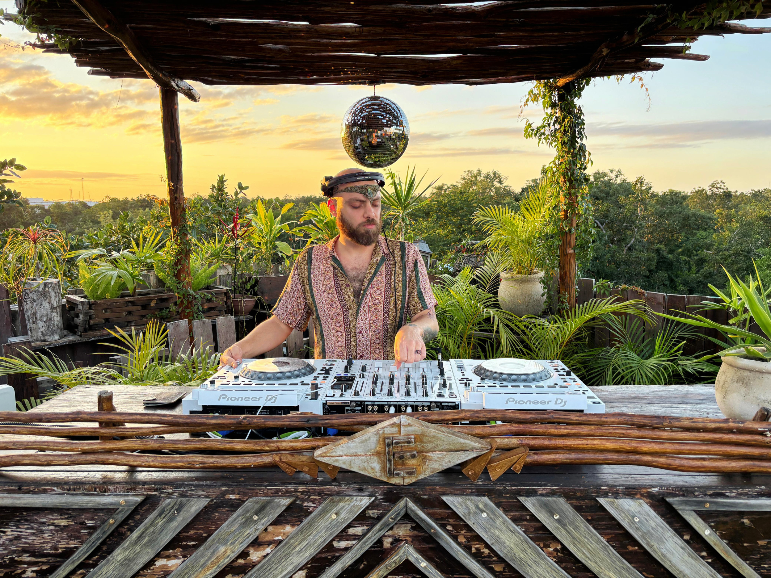 Guru Davar at a jungle rooftop in Tulum at sunset